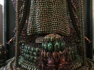 Illustration for article titled Japanese Statues Made with Dead Bugs